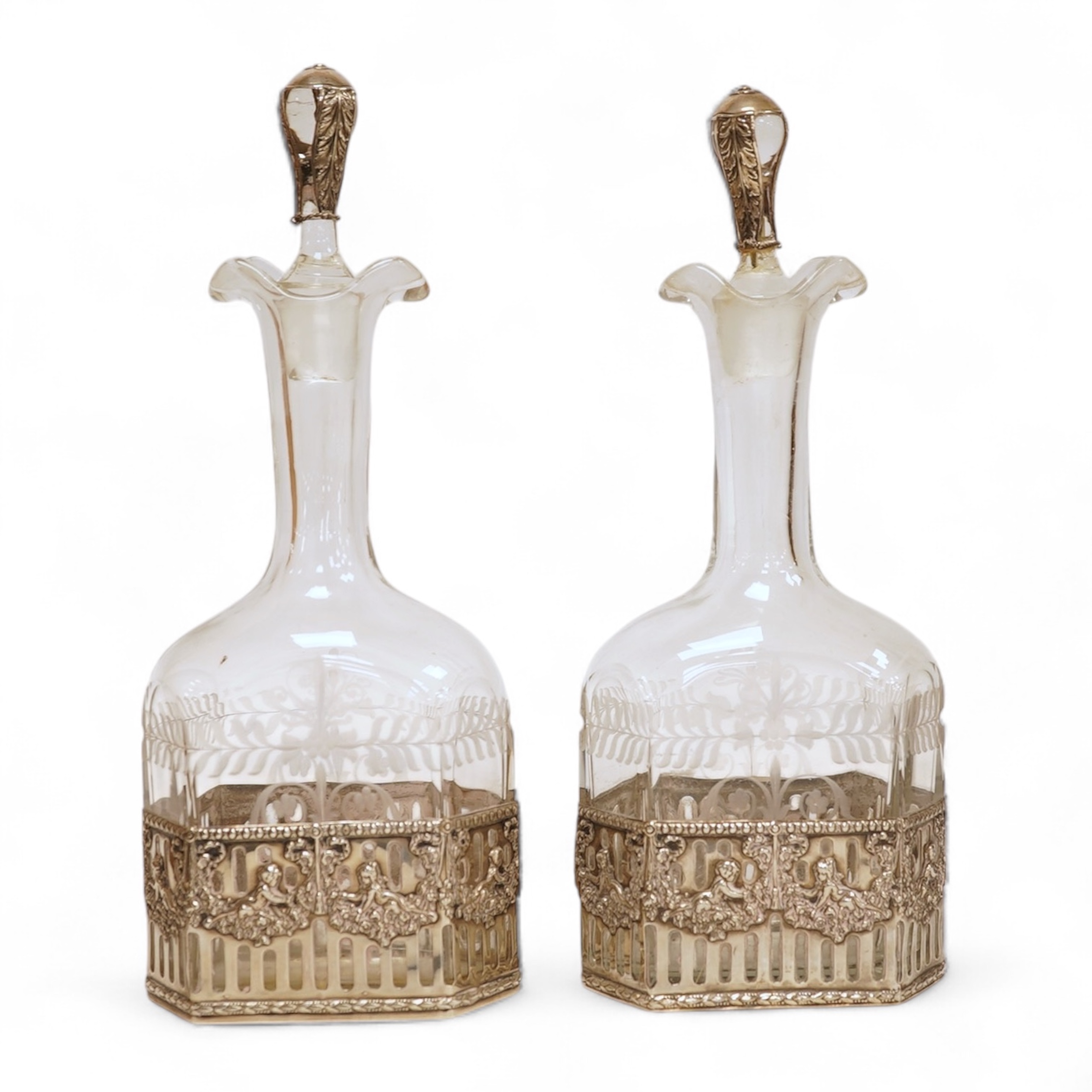 A pair of Hanau silver mounted moulded glass decanters and stoppers, by Berthold Muller, import marks for Glasgow, 1900/1901, 24cm, a.f.